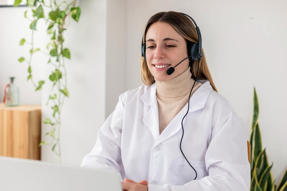 Remote virtual medical assistant scheduling patient appointments and managing calendars for a healthcare practice.